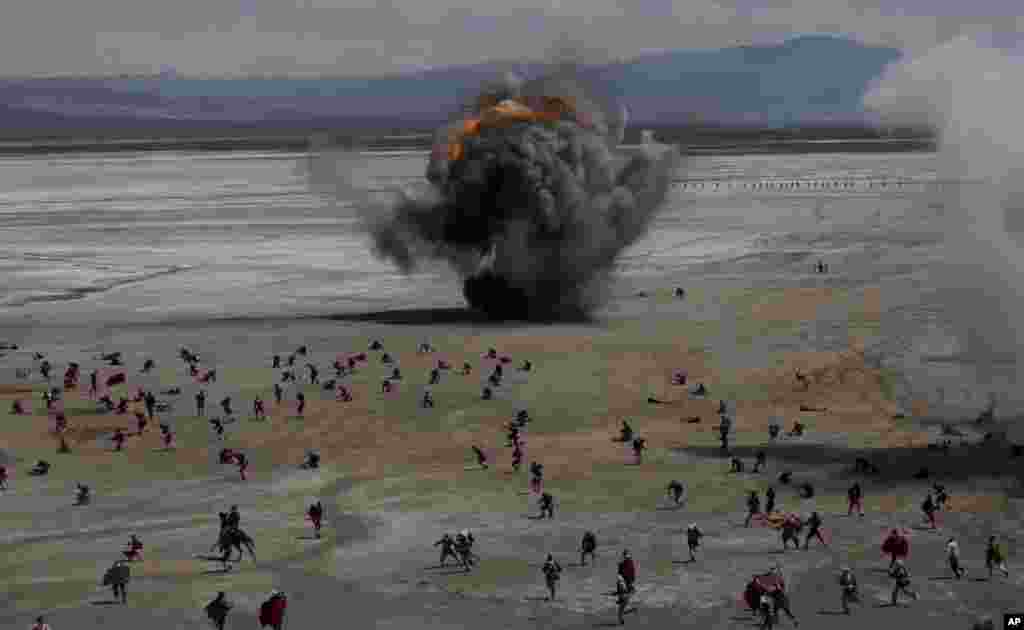 Bolivian soldiers re-enact the battle of "Canchas Blancas," which took place during the Pacific War in 1879 when Bolivia lost to Chile and in effect lost its access to the sea, in Canchas Blancas, Bolivia, the sight of the actual battle, March 28, 2019.