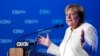 German Chancellor Angela Merkel gestures during her speech at a state election campaign in Munich, Germany, Sept. 24, 2021, two days before Sunday's general election. 