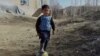 Murtaza Ahmadi's improvised shirt is made from a plastic bag and has Argentine footballer Lionel Messi's name scrawled on it with a marker pen.