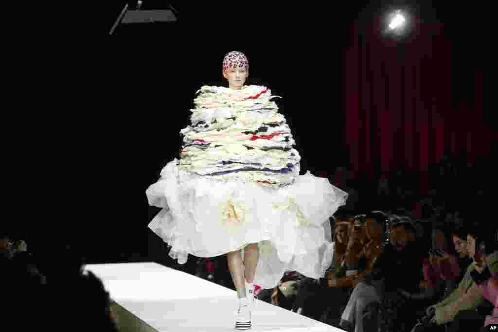 A model wears a creation for the Comme des Garcons ready-to-wear fall/winter 2018/2019 fashion collection presented in Paris, France, March 3, 2018.