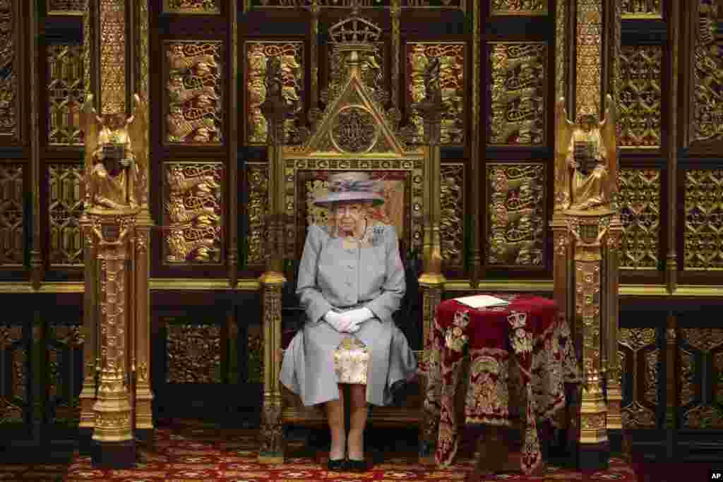 Britain's Queen Elizabeth II delivers a speech in the House of Lords during the State Opening of Parliament at the Palace of Westminster in London.