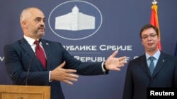 FILE - Albanian Prime Minister Edi Rama, left, and his Serbian counterpart Aleksandar Vucic attend a news conference after their meeting in Belgrade, Serbia, Nov. 10, 2014.