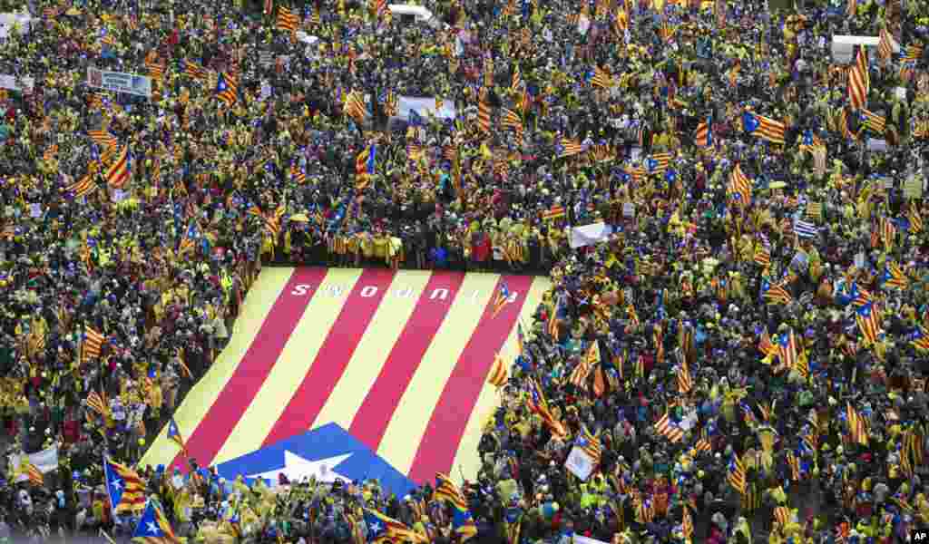 Pro-independence Catalan supporters gather to begin a demonstration near the EU quarter in Brussels.
