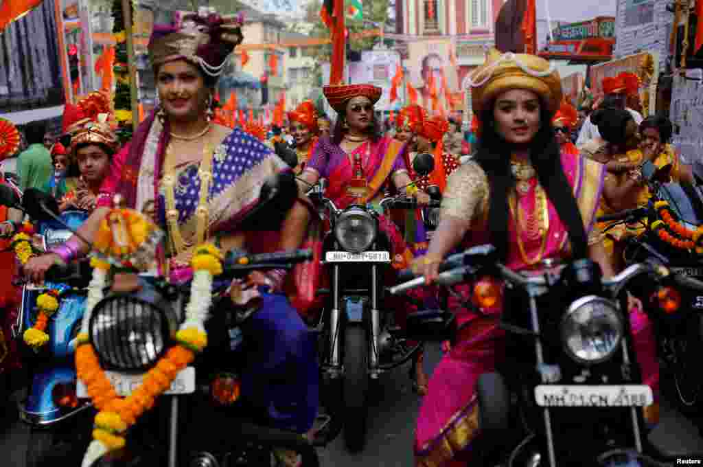 Women dressed in traditional costumes ride motorbikes as they attend celebrations to mark the Gudi Padwa festival, the beginning of the New Year for Maharashtrians, in Mumbai, India.