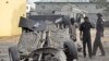 The wreckage of a car near the zonal police headquarters after a bomb attack in Nigeria's northern city of Kano.