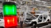 FILE - A worker assembles a car at a factory for Chinese automaker BAIC Motor in Beijing.