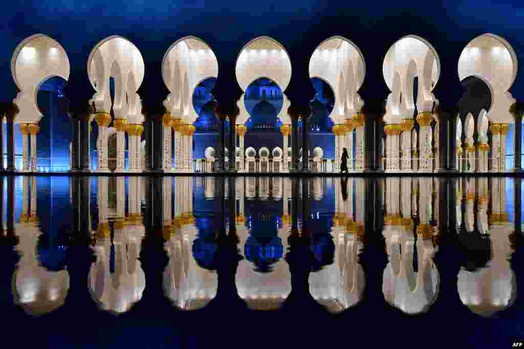 Visitors walk in the courtyard of the Sheikh Zayed Grand Mosque in the UAE capital Abu Dhabi.