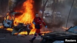 Наслідки удару РФ по Києву, 10 жовтня 2022. REUTERS/Gleb Garanich