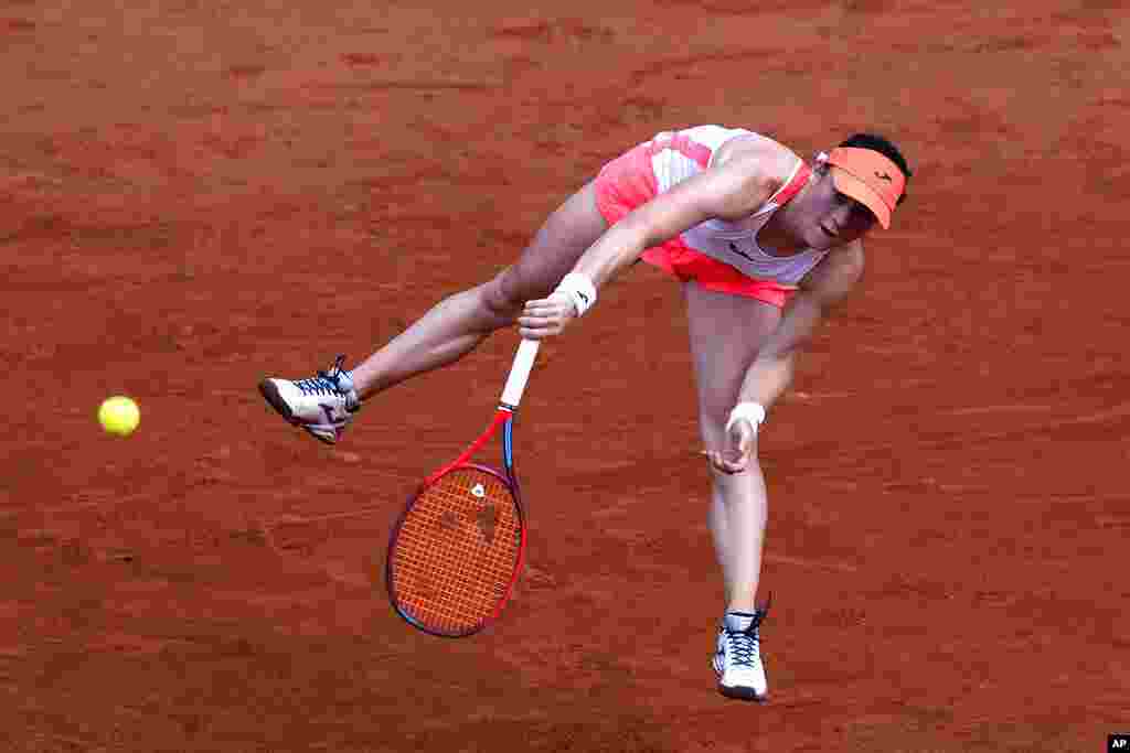 Slovenia's Tamara Zidansek serves to Spain's Paula Badosa during their quarterfinal match of the French Open tennis tournament at the Roland Garros stadium in Paris.