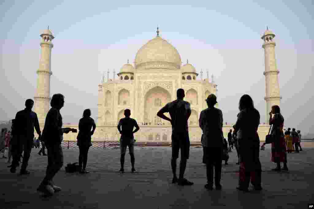 Tourists visit India's famed monument of love, the Taj Mahal, in Agra, India. The 17th century white marble monument is India's biggest tourist draw, with about 3 million visiting every year.