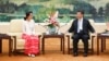 Chinese President Xi Jinping (R) meets Myanmar's pro-democracy leader Aung San Suu Kyi at the Great Hall of the People in Beijing on June 11, 2015.