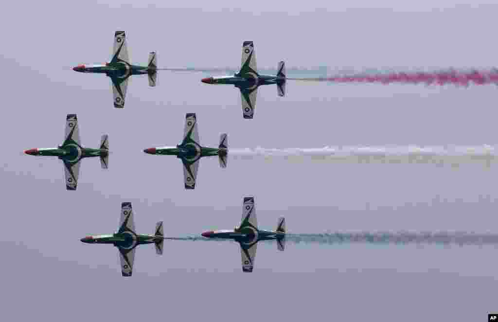 Pakistani Air Force jets demonstrate an aerobatic performance during a full dress rehearsal of a military parade to mark Pakistan's Republic Day in Islamabad.