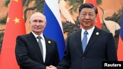 Ілюстративне фото. Президент Росії Владімір Путін і голова Китаю Сі Цзіньпін під час зустрічі на Форумі "Один пояс, один шлях" у Пекіні, Китай, 18 жовтня 2023 року. Sputnik/Сергій Гунєєв/REUTERS