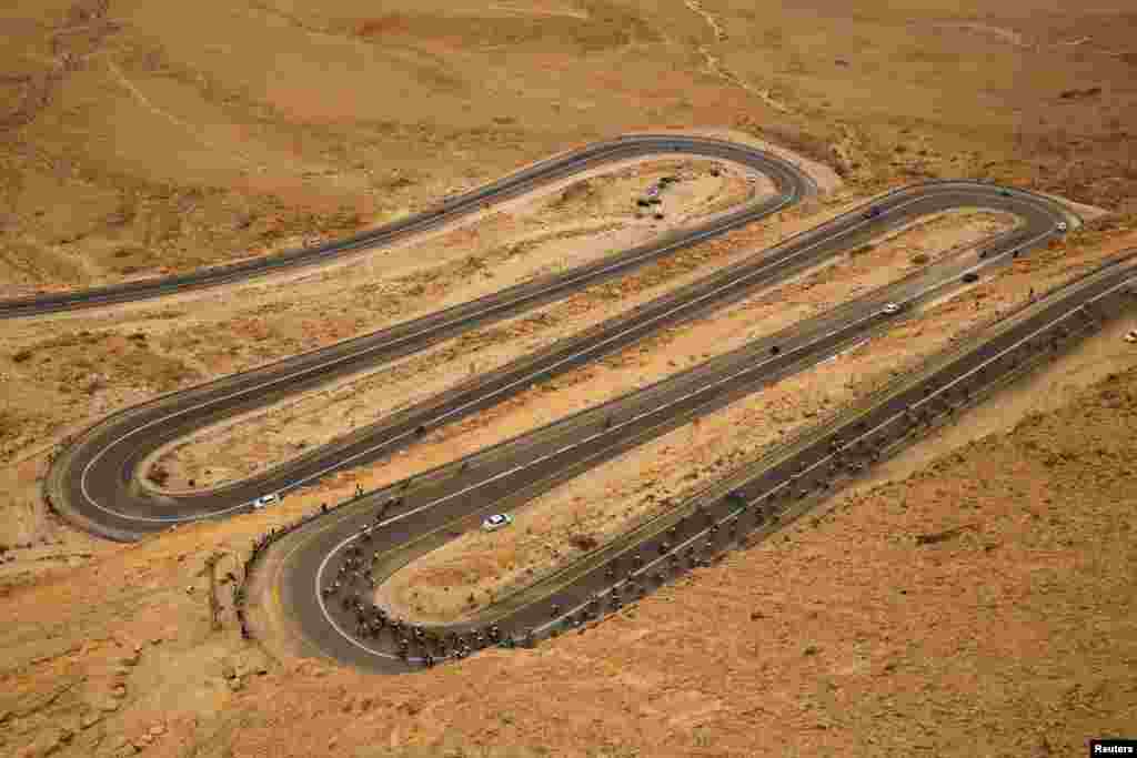 Riders compete on a main road near Mitzpe Ramon during the 229-km Stage 3 of the 101st d'Italia cycling race from Beersheba to Eilat, Israel. 