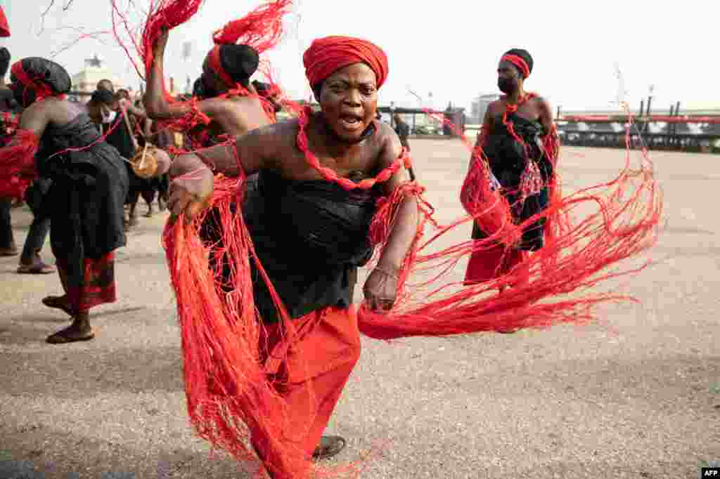 A traditional group performs the final funeral rites of former Ghana President Jerry John Rawlings in Accra.
