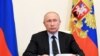 Russian President Vladimir Putin attends a meeting via video conference at the Novo-Ogaryovo residence outside Moscow, Russia, Wednesday, June 10, 2020. Putin held a meeting on IT and telecom industries on Wednesday and urged the government to make…