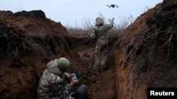 Бійці 58-ї окремої мотопіхотної бригади неподалік Бахмута, 25 листопада 2022. REUTERS/Leah Millis