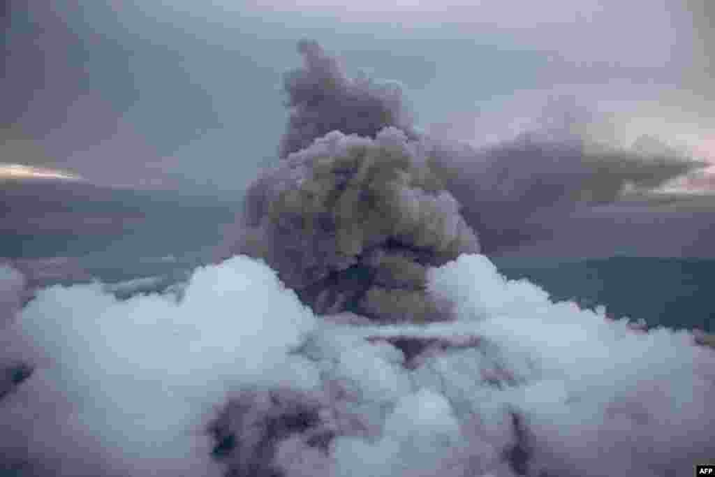 This aerial photo shows the column of ash expelled from the crater of Nyiragongo volcano, north of Goma, the provincial capital of North Kivu, Democratic Republic of Congo, May 30, 2021.
