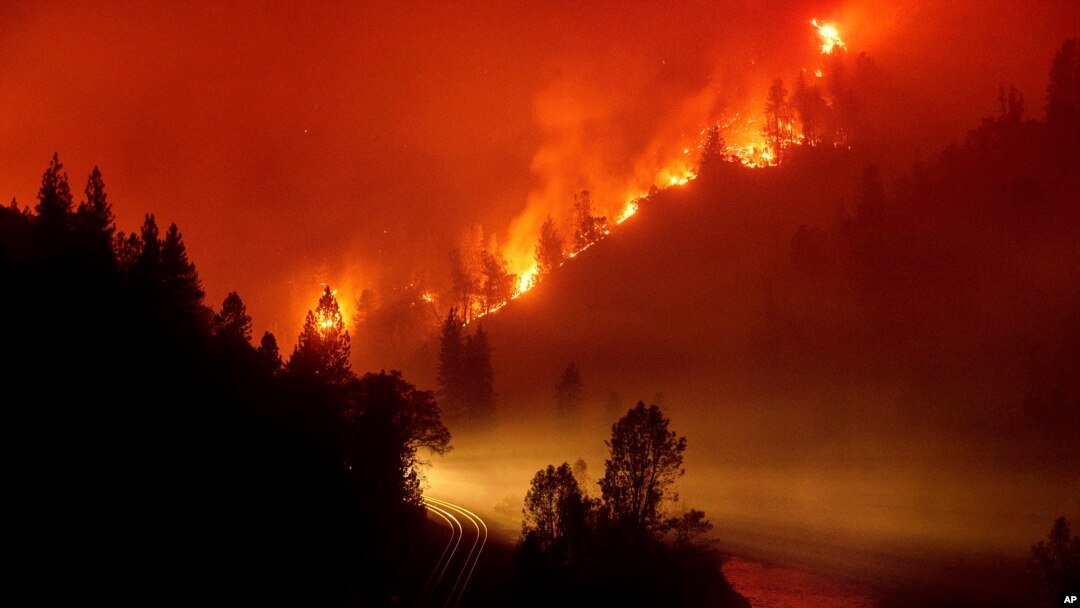 FILE - The Delta Fire burns in the Shasta-Trinity National Forest, California, Sept. 6, 2018. 