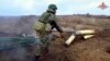 Фото з відео, розповсюдженого міністерством оборони Росії 12 листопада 2022 р. (Russian Defense Ministry Press Service via AP)