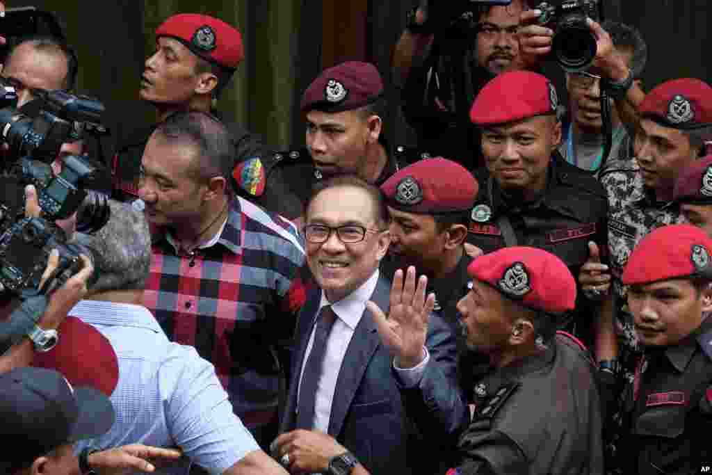 Malaysia's reformist icon Anwar Ibrahim arrives at his house in Kuala Lumpur. Anwar Ibrahim has been freed from custody after receiving a royal pardon, paving the way for a political comeback following his alliance's stunning election victory.