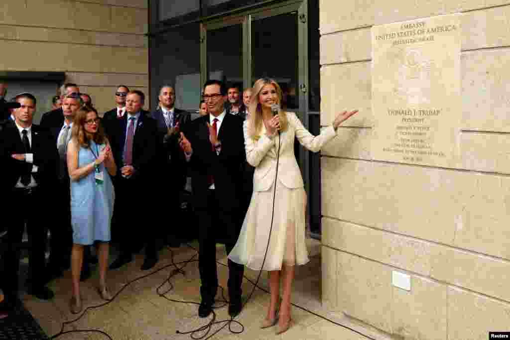 U.S President's daughter Ivanka Trump unveils an inauguration plaque as U.S. Treasury Secretary Steven Mnuchin claps during the opeing of the U.S. embassy in Jerusalem.