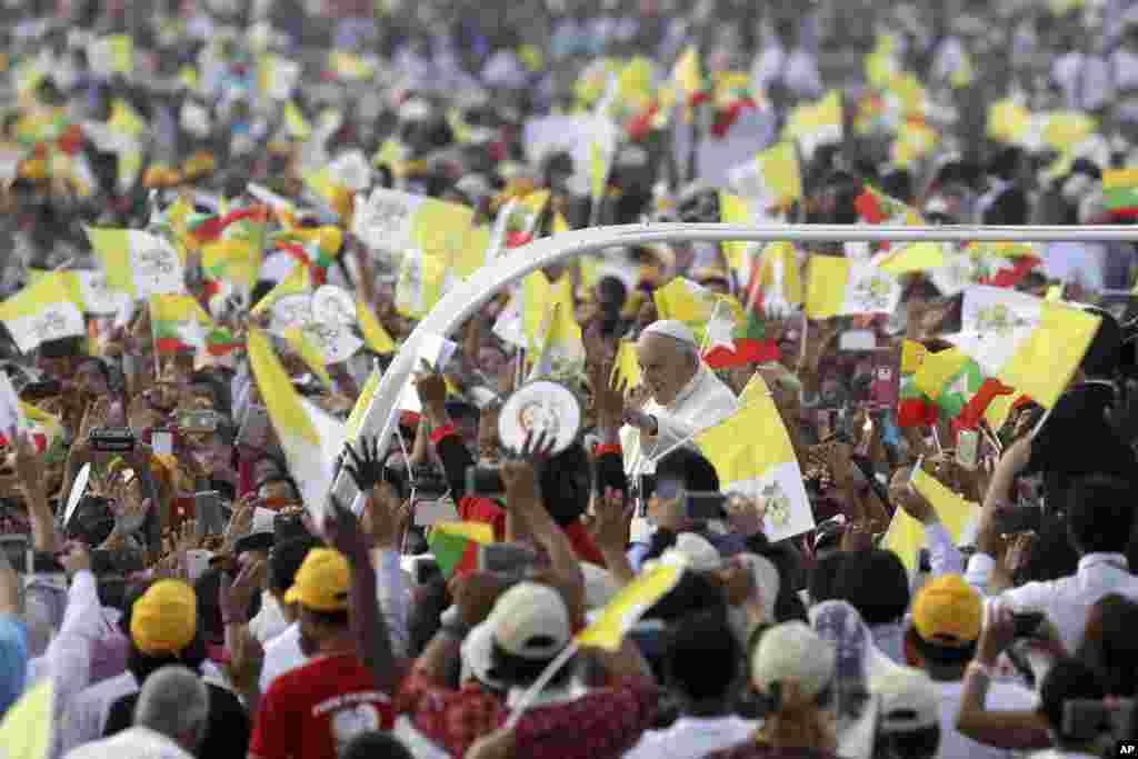 Pope Francis arrives to celebrate a Mass in the Kyaikkasan Ground in Yangon, Myanmar.