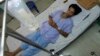 FILE - San Petchrod, 47, lies in bed where he is being treated for malaria at Sai Yoke hospital, Kanchanaburi Province, Thailand, Oct. 26,2012. 