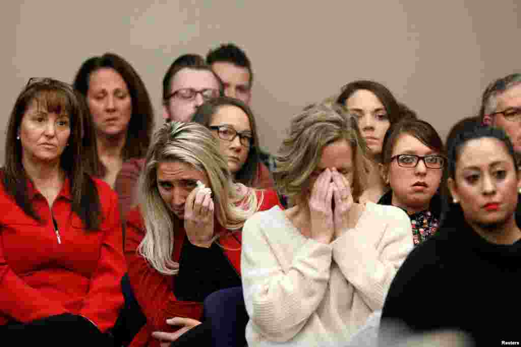 Victims and others look on as Rachael Denhollander speaks at the sentencing hearing for Larry Nassar, a former team USA Gymnastics doctor who pleaded guilty in Nov. 2017, to sexual assault charges, in Lansing, Michigan.