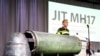 На фото: рештки ракети під час доповіді слідчих у справі збиття MH17
