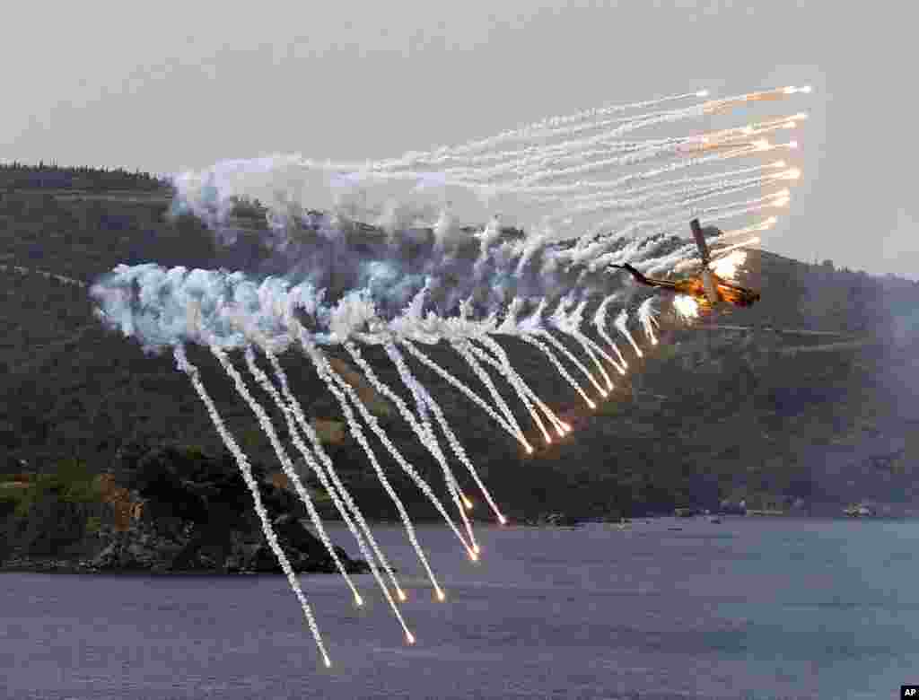 A Turkish Army helicopter takes part in the EFES 2018 drills in Seferihisar, by the Aegean Sea, near Izmir, Turkey.