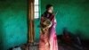 FILE - Traditional Xhosa initiate Fezikhaya Tselane, 20 years old, stands during a traditional initiation process in a rural hut in the Coffee Bay area in Umtata, South Africa, July 11, 2017.