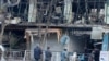 阿富汗警察在正在喀布尔的一处炸弹爆炸现场进行调查。（2018年1月28日）