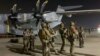 French Special Forces soldiers stand guard near a military plane at airport in Kabul on August 17, 2021, as they arrive to evacuate French and Afghan nationals.