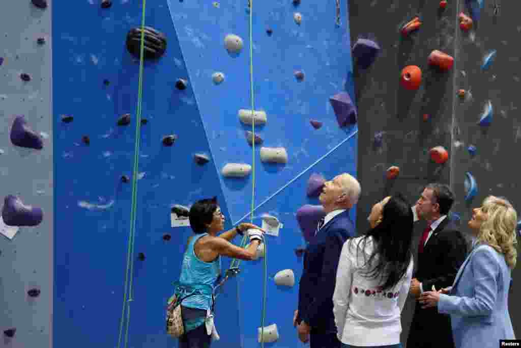 U.S. President Joe Biden and first lady Jill Biden meet with Virginia Governor Ralph Northam to discuss the state's progress against the coronavirus pandemic at Sportrock Climbing Centers in Alexandria, Virginia.