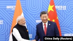 中国领导人习近平与印度总理莫迪在俄罗斯喀山出席金砖国家峰会期间举行会晤。在中国外交部副部长孙卫东和印度外秘唐勇胜结束于北京举行的副外长/外秘级对话之后，双方就一系列改善中印关系的举措达成具体共识（2024年10月23日）