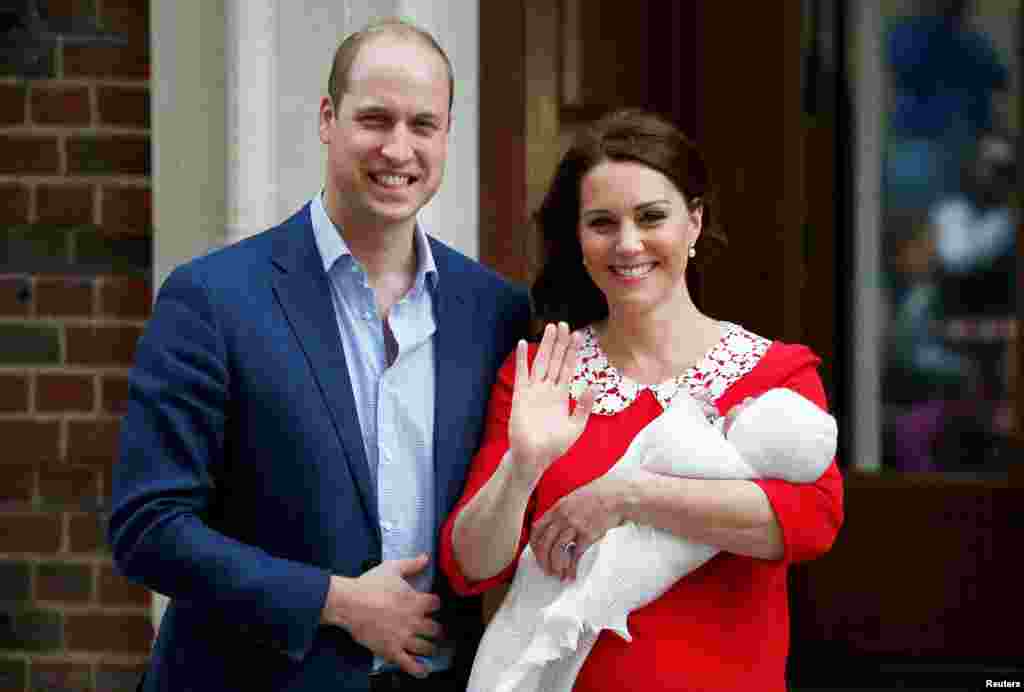 Britain's Catherine, the Duchess of Cambridge and Prince William leave the Lindo Wing of St.Mary's Hospital with their new baby boy in London.